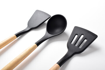 Silicone cooking utensils set with wooden handle isolated on white background. Kitchen tool sets