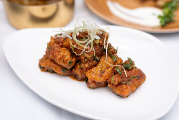 Seafood dish with spring onion and spice 