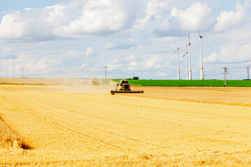 Combine Harvester Cutting Wheat, modern combine harvester working on a wheat crop. combine...