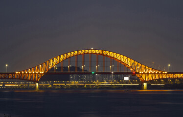 Goyang-si, Gyeonggi-do, South Korea - May 29, 2022: Night view of Banghwa Bridge on Han River with illumination