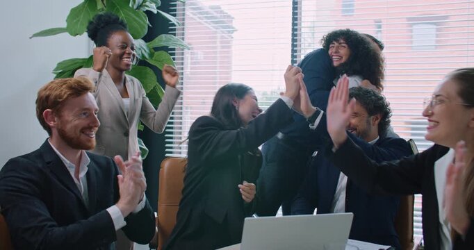 Diverse group of people sitting in front of laptop. Woman pressing one button and everyone exclaiming. Business meeting. Signing deal remotely. Sending important email. Receiving feedback.