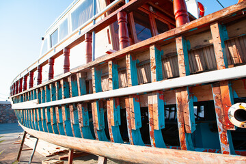 Wooden boat construction site on beach of Alanya - Small Boat stands on repairs supports in a dry dock