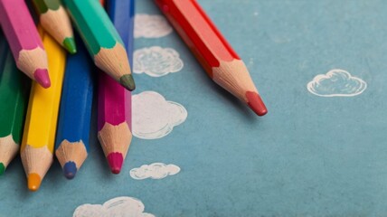 School multicolored supplies pencils and a drawn cloud