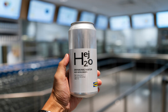 PENANG, MALAYSIA - AUG 14, 2024: Hand holding IKEA Hej H2o Can (IKEA Drinking Water) with isolated blur background