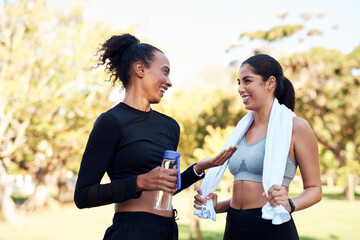Break, exercise and talking with woman friends outdoor in park together for conversation or performance. Fitness, health and smile with happy athlete people speaking in nature for training challenge