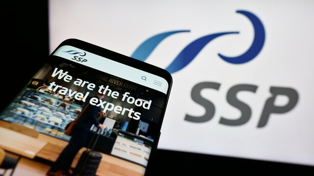 Stuttgart, Germany - 08-09-2024: Mobile phone with website of British travel foodservice company SSP Group plc in front of business logo. Focus on top-left of phone display.