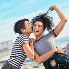 Friends, kiss and beach portrait on holiday, travel together and happiness on weekend trip. People, women and outdoor for security in relationship by ocean, energy and bonding on promenade by sea