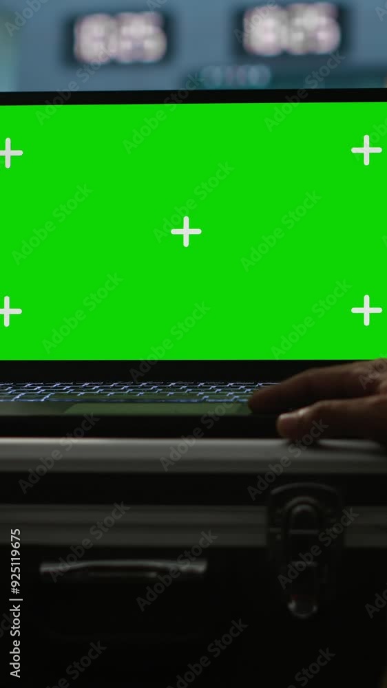 Poster vertical video military agent working in control room, using isolated screen software on laptop, ana