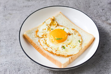 a plate of fried eggs and toast