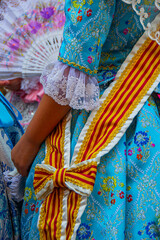 Close-up of a girl's dress at the regional festivities of Hogueras of San Juan, in Javea, Spain....