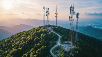 Aerial view of communication towers on a mountain, transmitting signals over a wide area.