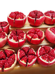 Fresh pomegranate. Picture of a pomegranate cut in half to reveal the seeds inside.