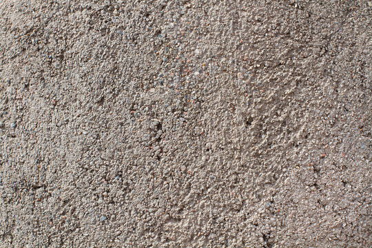 Fondo de pared de cemento con textura gris y finos. Vista de frente y de cerca. Copy space