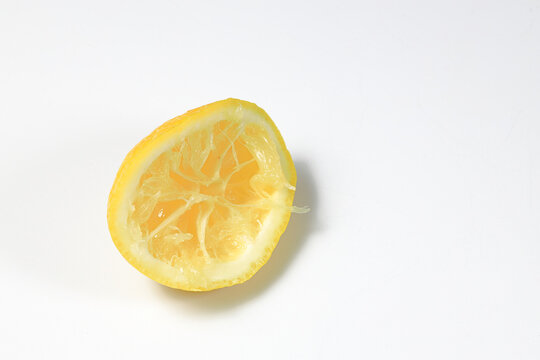 Fresh squeezed lemon fruit isolated on white background.