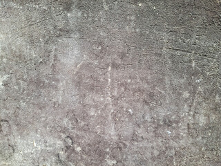 Obraz premium The background is made of an old worn, gray-black surface