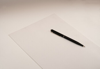 Blue pen on a white paper ready for writting