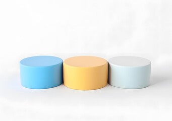 Minimalist Product Display with Three Cylindrical Platforms in Blue, Yellow, and Light Blue