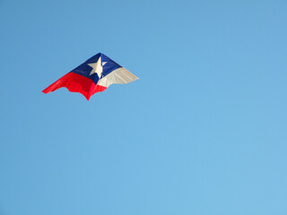 Flying kite designed with the Chilean flag