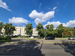 empty street with blue sky and clouds in Berlin Treptow/Köpenick