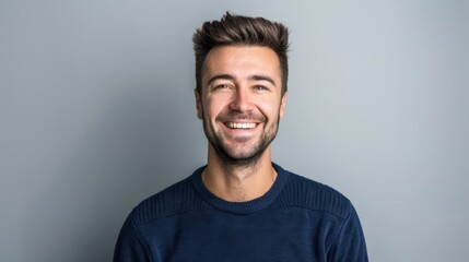 The smiling bearded man