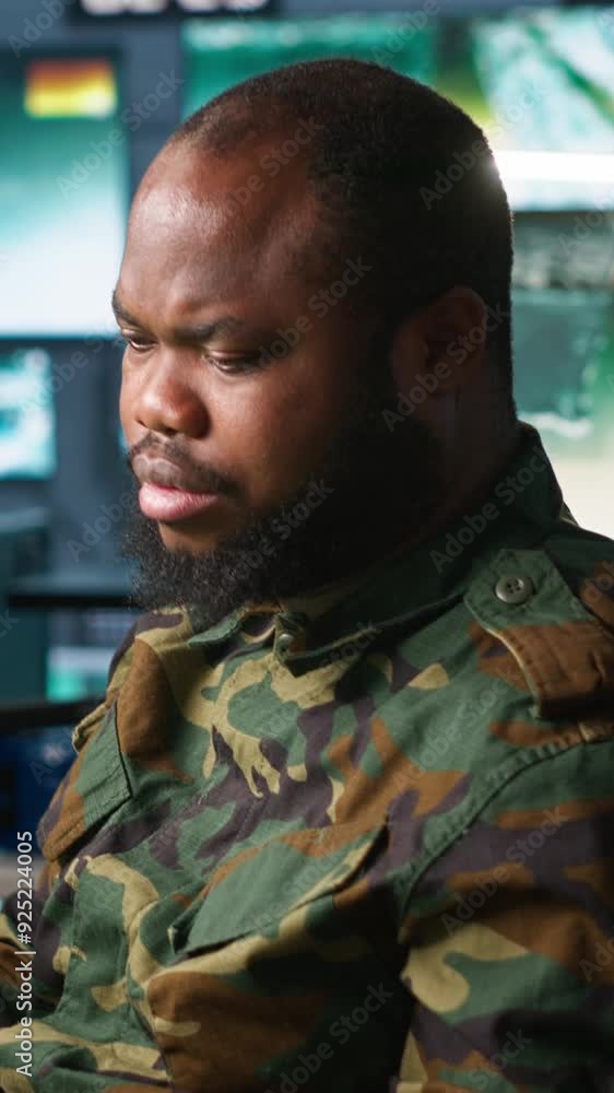 Poster vertical video counterintelligence specialist in military hq base gathering information on enemy tro