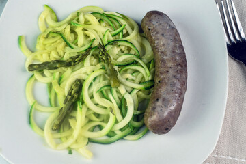 zucchini noodles  top with asparagus  with  itian sausage