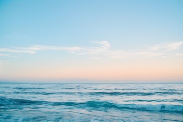 Calm Ocean Water with Pink Sunset Sky