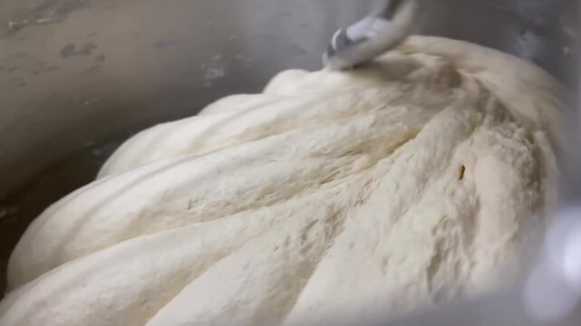 Close-up in electric spiral kneading machine for kneading dough