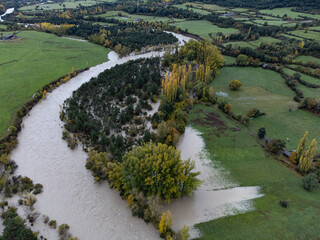 Rio Ara overflows as it passes through Fiscal (Huesca). Aragonese Pyrenees