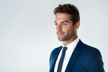 Businessman, smile and thinking on studio mockup for pride, opportunity and success in legal career. Professional, corporate and face on white background space with confidence, experience and fashion