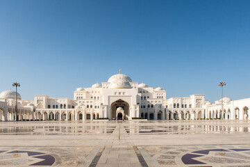 UAE Presidential Palace Qasr Al Watan, exterior outside symmetric view from the entrance, with white limestone decorated walls and majestic dome, no people.