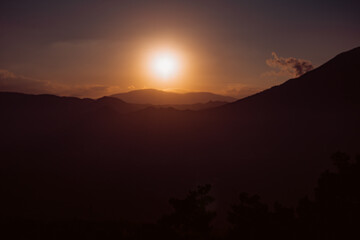 Smoky Sunset View from the Top of a Mountain