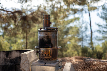 Old traditional turkish retro stove and teapot for brewing tea 