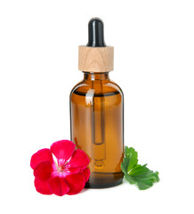 Bottle of geranium essential oil, beautiful flower and green leaf isolated on white