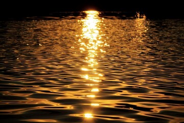 The setting sun casts reflections on a calm body of water, Reflections of the setting sun on a calm body of water, shimmering like liquid gold
