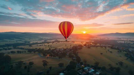 Fototapeta premium Hot Air Balloon Soaring Over Rural Landscape at Sunrise