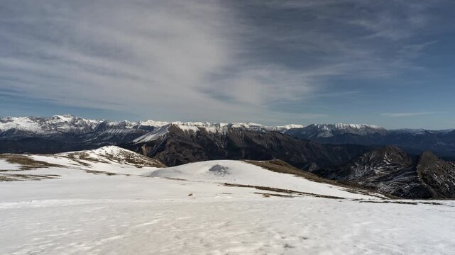 Stunning panorama shot of snowcapped ecrins mountain range in france, Des Monges alps. Clear blue skies and rugged peaks create a perfect backdrop for nature, adventure, destination and travel themes.