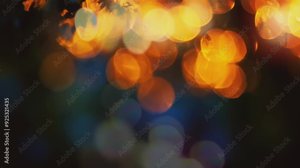 Poster a blurred background of warm, glowing lights creating a bokeh effect.