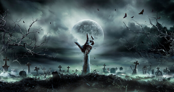 Zombie Hand Rising Out Of A GraveYard - Halloween