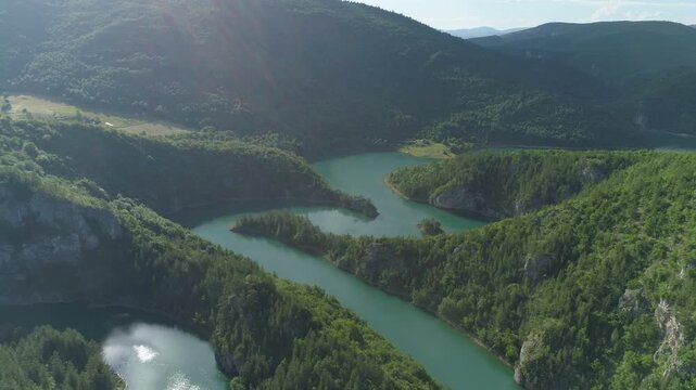 aerial view of a picturesque river meandering among the hills