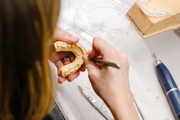 Dental technician working on a dental impression