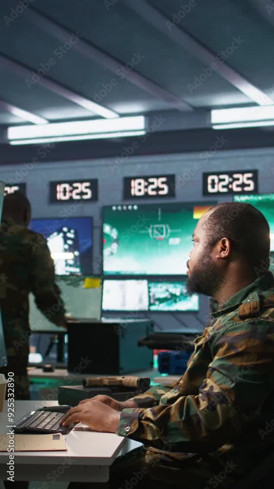 Poster vertical video military agent working in control room, analyzing aerial reconnaissance data and talk