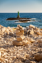 Stacked stone boulders on the top of each other at the Punta Planka beach, Croatia