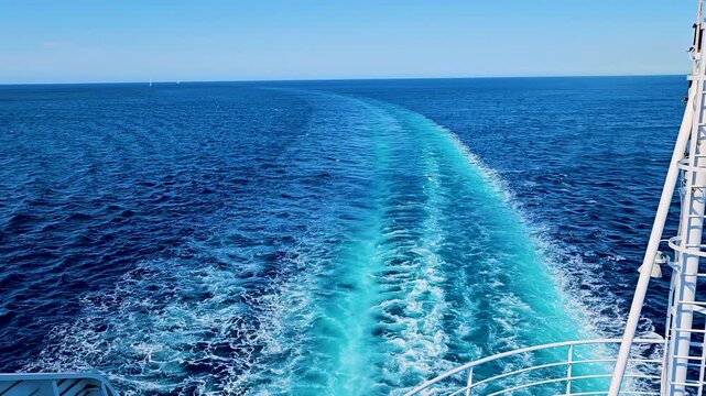 Wake of ship's engines in open sea while sailing in the Mediterranean Sea