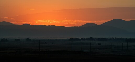 Beautiful orange sunrise over the mountains