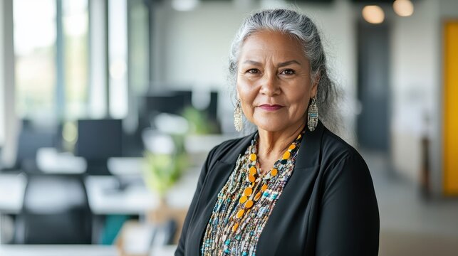 senior indigenous business woman portrait in modern office, diversity.