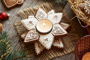 Candlestick made of homemade gingerbread Christmas cookies decorated with white