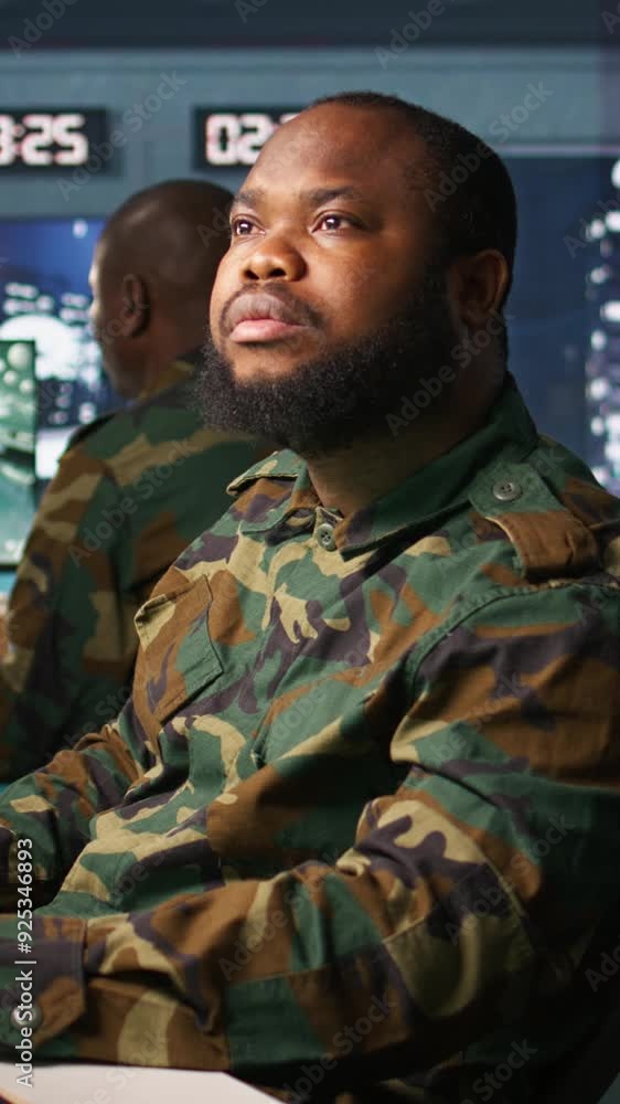 Poster vertical video officer doing tasks in military base, planning, analyzing and gathering information o