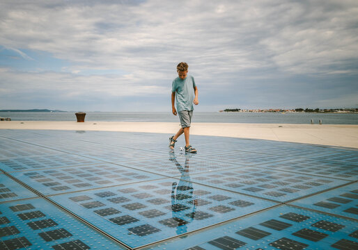 A boy playing with small ball