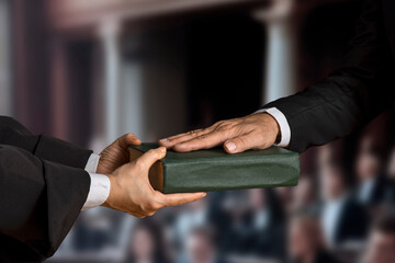 Hand on the Bible in court or the oath on the constitution book during the inauguration in parliament. Oath of Office.